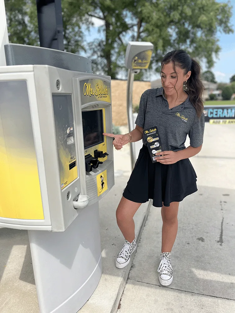 Employee at Mr. Splash payment kiosk