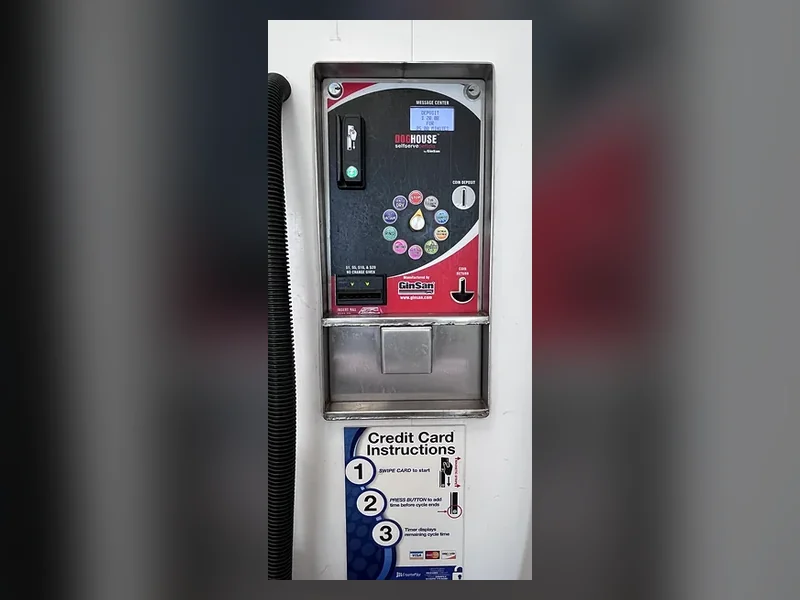 The self-serve dog wash payment station, which takes both cards and coins