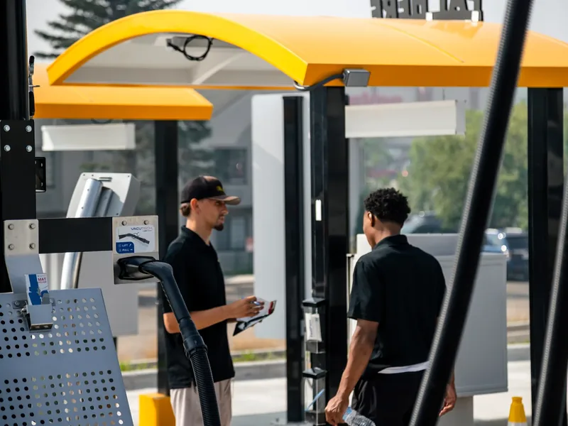Driver's view pulling up to the pay station canopy at Mr. Splash Madison East on E Washington Ave