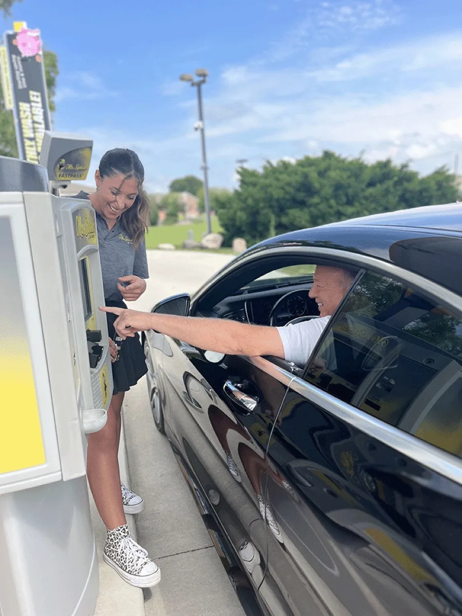 Mr. Splash employee helping a customer